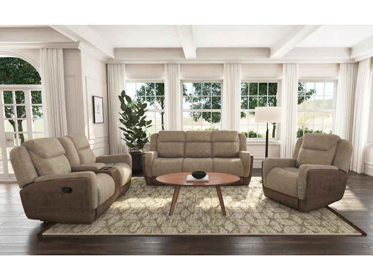 Bright living room with beige sofas, armchairs, coffee table, large windows, and a patterned rug.