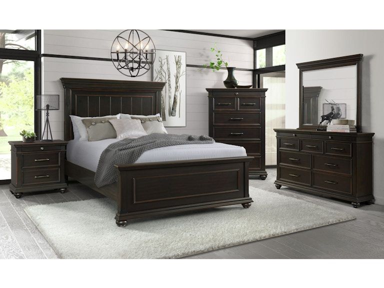 Dark wood bedroom set with bed, dresser, nightstands, and mirror in a bright modern room
