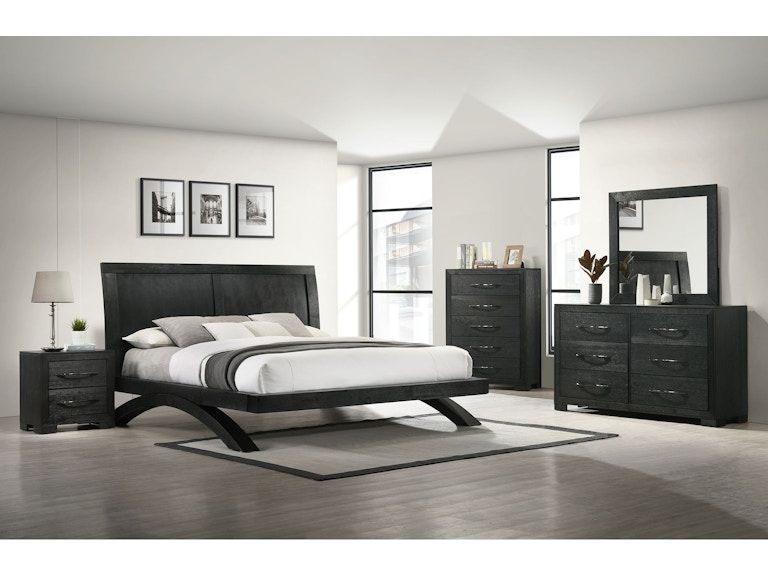 Modern black-and-white bedroom with a bed, matching dressers, nightstands, and framed wall art.