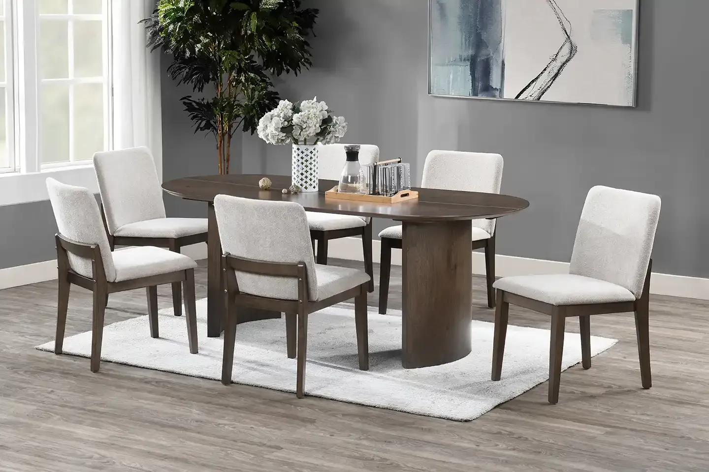 Modern dining room with a wooden table, six white upholstered chairs, and a rug over gray flooring