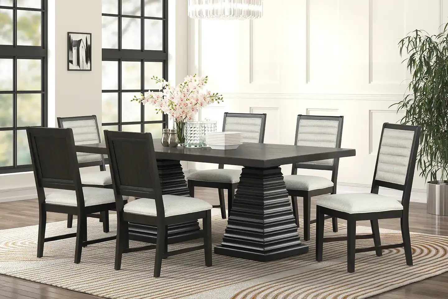 Modern dining room with six black chairs, dark table, and white decor by a window