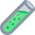 Test tube with green liquid and bubbles.