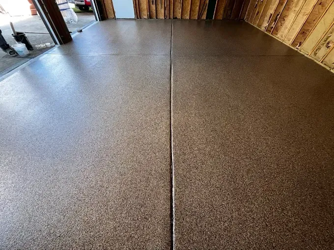 Brown speckled epoxy garage floor.