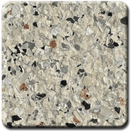 Close-up of a speckled, light-colored floor with chips of gray, black, and brown.