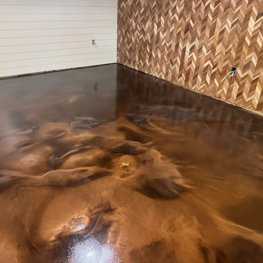 Brown metallic epoxy floor with a wooden accent wall.