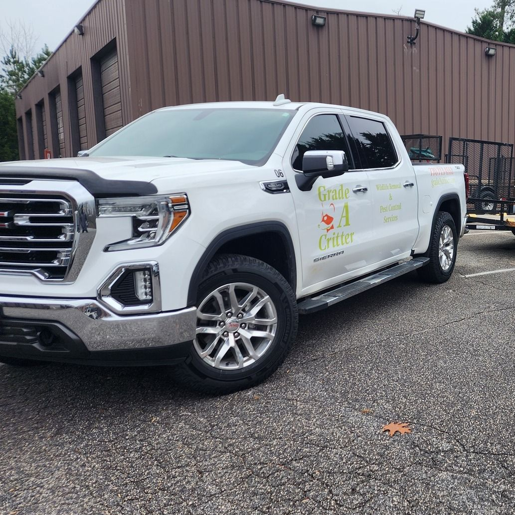 A white GMC Sierra pickup truck with