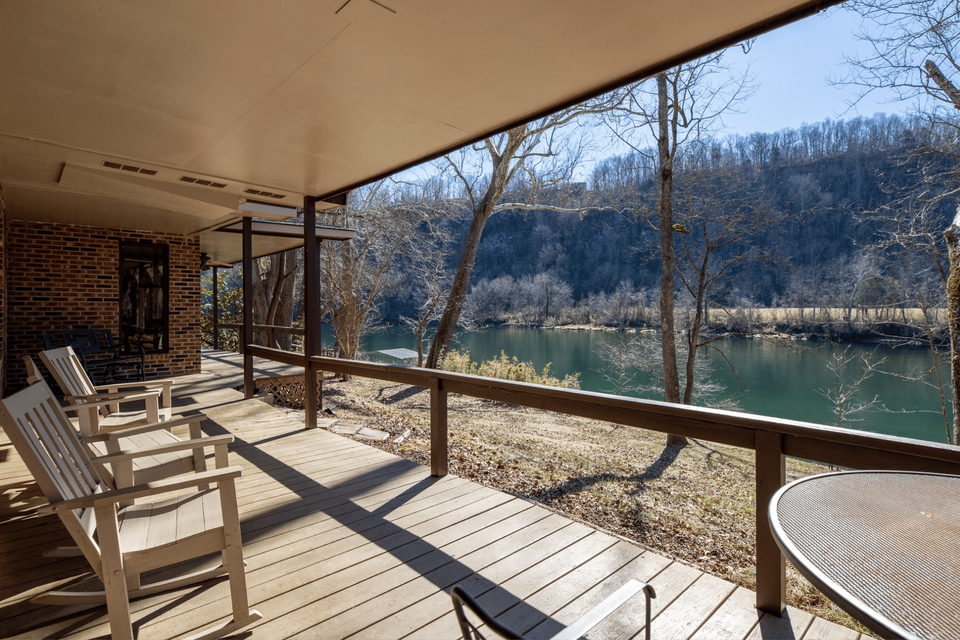 Cabin Overlooking White River Back porch of river front cabin