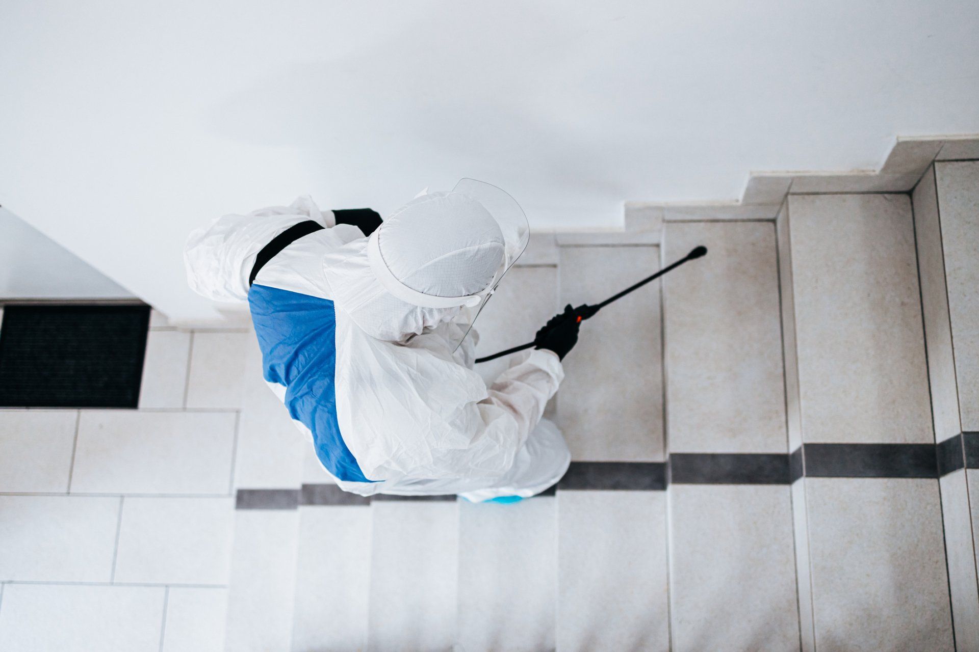 Manual Worker In Protective Work Wear Spraying Virus - Harrison, AR - Pest-X