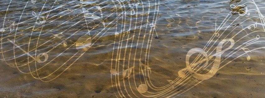 Musical notes overlay rippling water, creating a translucent effect on a sandy surface.