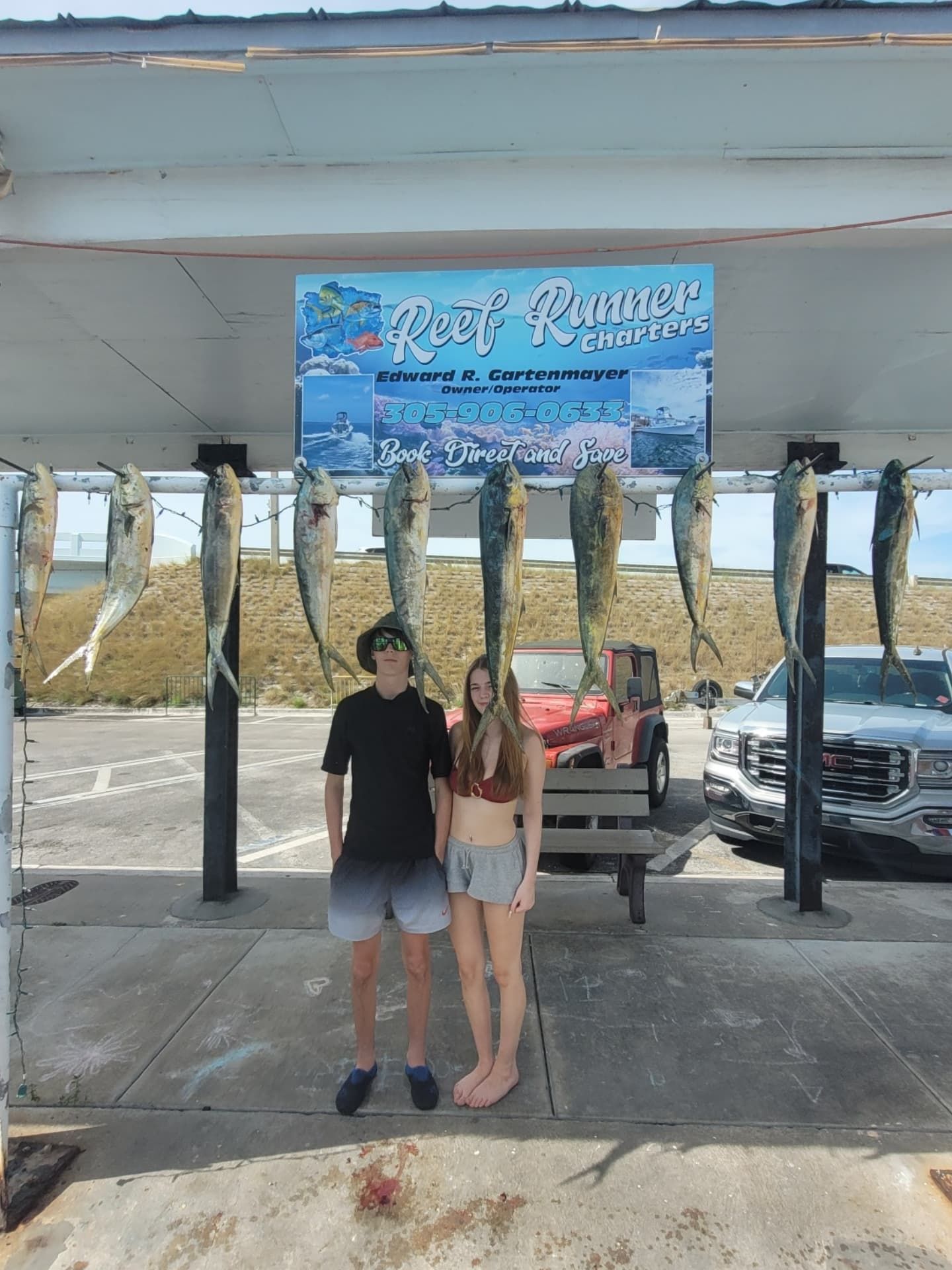 Two people stand under a 