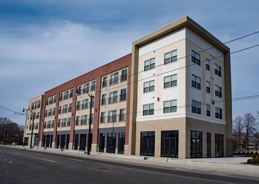 Multi-story Apartment Building With Retail Space on a Sunny Day — Rowal Constructions in New Lambton, NSW