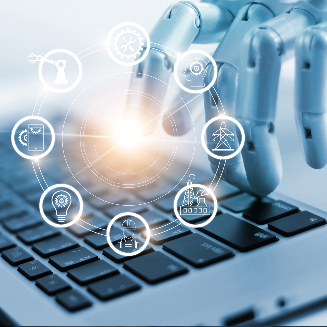 A robotic hand is typing on a laptop keyboard