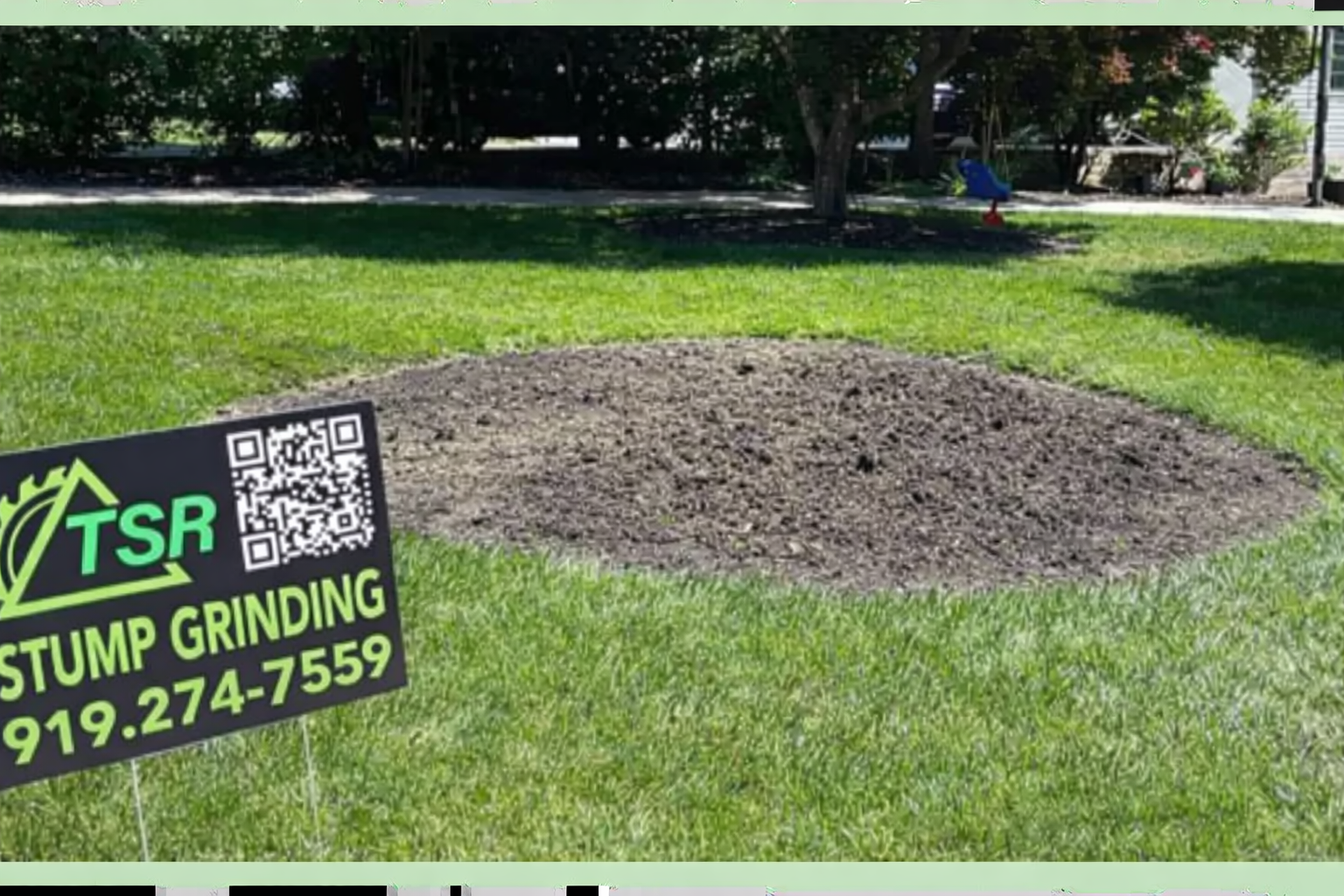 Stump grinding sign beside a freshly ground tree stump in a grassy yard