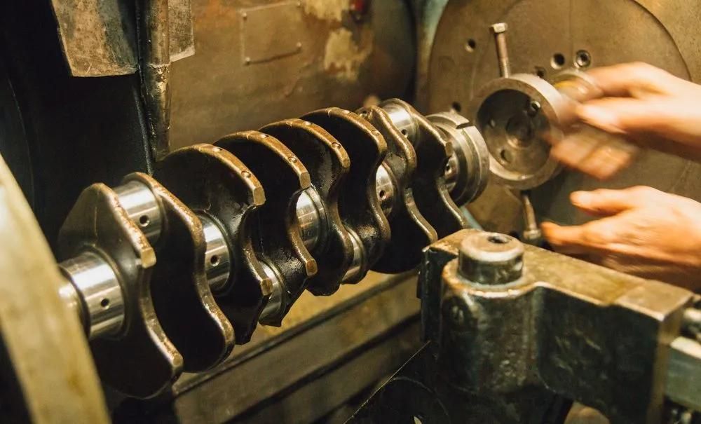 Mechanic Inspecting Crankshaft For Transmission Repairs In Townsville