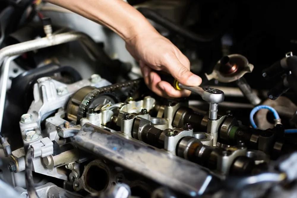 Mechanic Performing Transmission Repairs In Townsville On Vehicle Engine