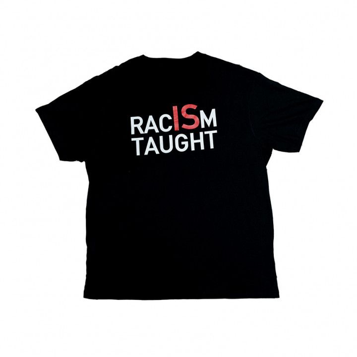 Black T-shirt with the words “RACISM TAUGHT” in white and red lettering.