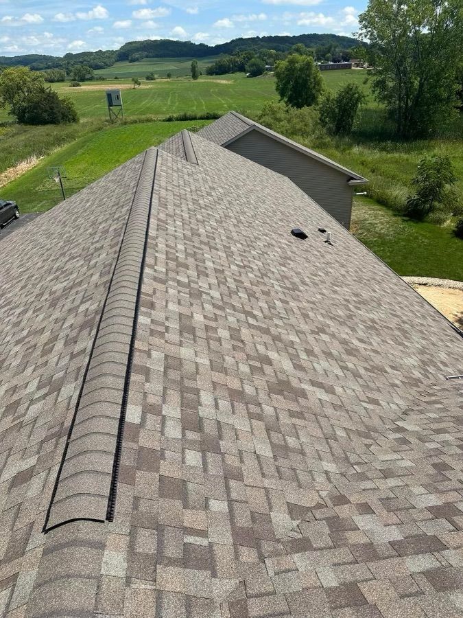 The roof of a house with a lot of shingles on it.