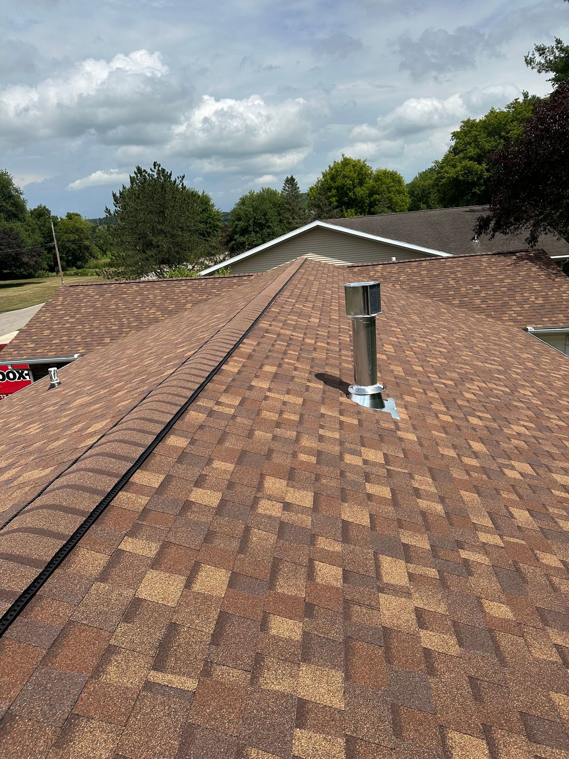 the roof of a house with a chimney on it .