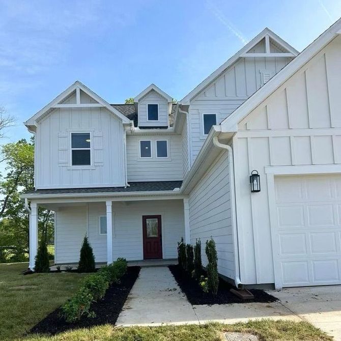 A large white house with a red door