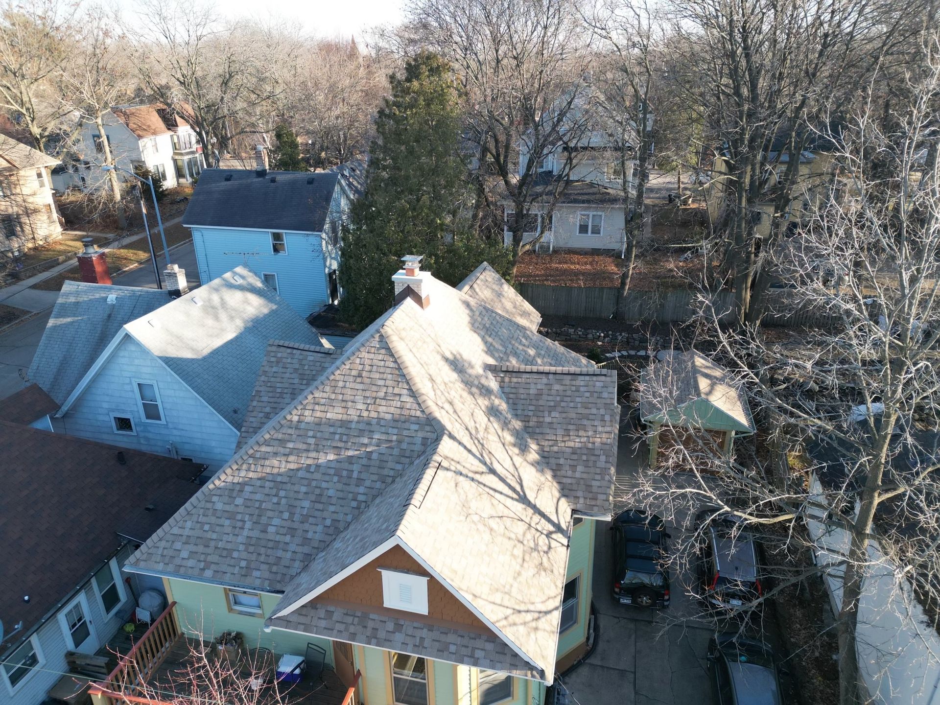 An aerial view of a house in a residential area