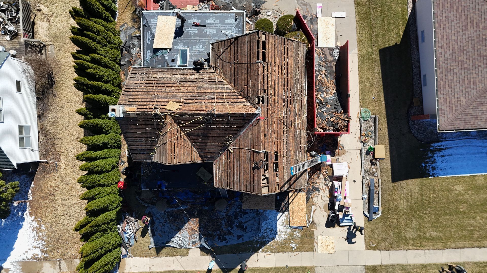 An aerial view of a house that is being demolished.