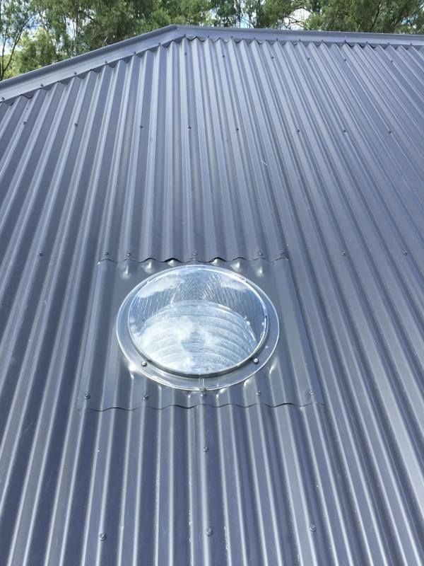 Roof with a clear skylight in the middle — Lilydale, QLD — SunCity Skylights