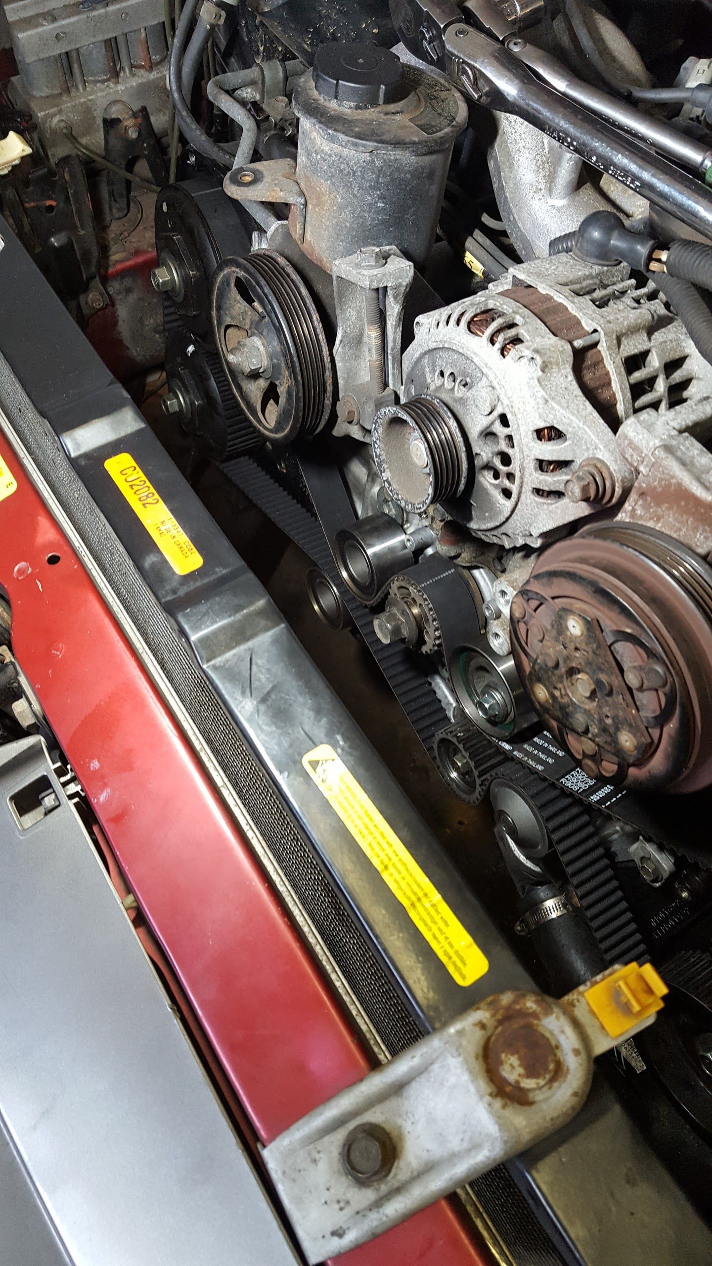 A Close Up of a Car Engine With a Radiator and Alternator | OTRAMM Auto Repair