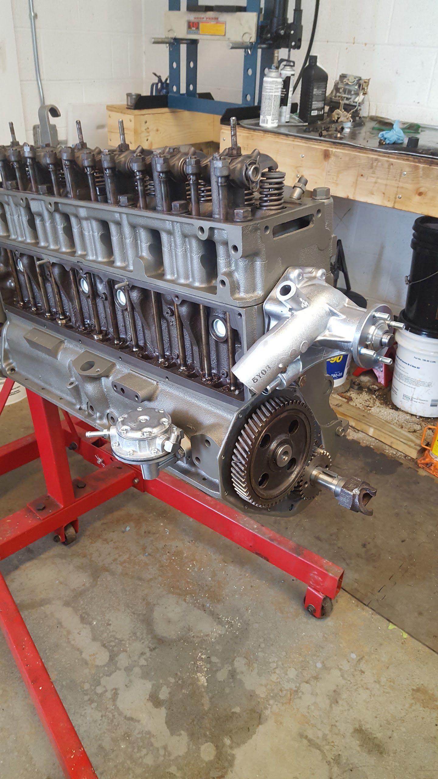 A Large Engine Is Sitting on a Red Stand in a Garage | OTRAMM Auto Repair