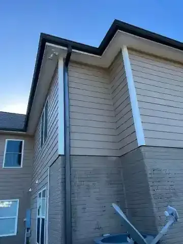 Lance Gutter & Pressure Washing professional gutter installation on a residential home