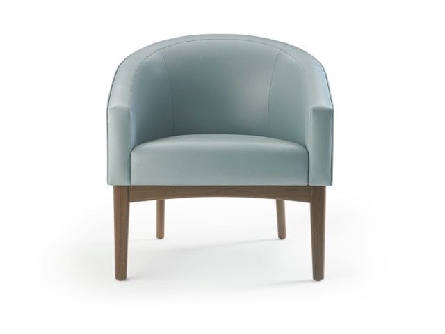 Light blue upholstered armchair with wooden legs on a white background