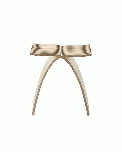 Minimalist wooden stool with curved legs and a slatted top against a white background