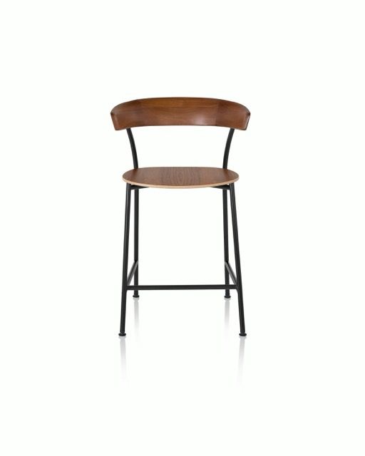 Wooden bar stool with black metal legs on a white background