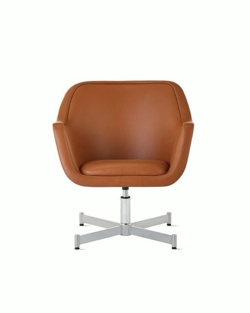 Brown leather swivel armchair with chrome base on a white background