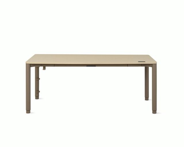 Minimalist beige rectangular table with four legs on a white background