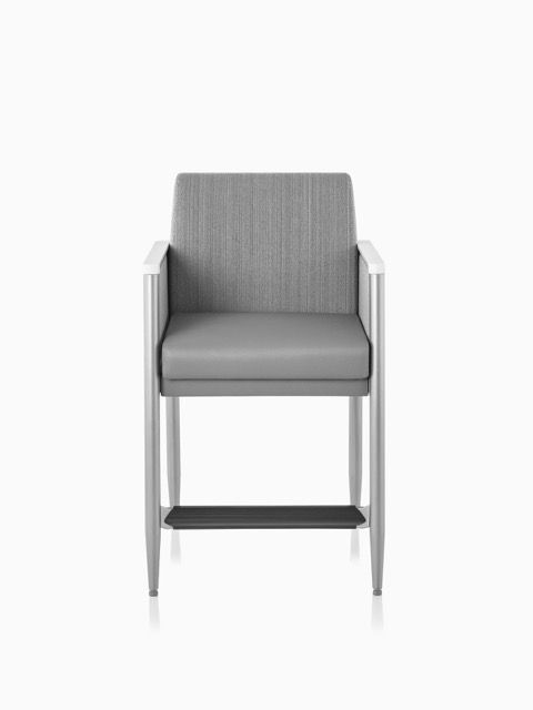 Gray upholstered bar stool with armrests and a metal frame on a white background