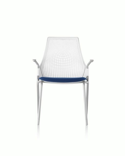 White mesh chair with blue seat cushion and chrome legs, front view on a white background