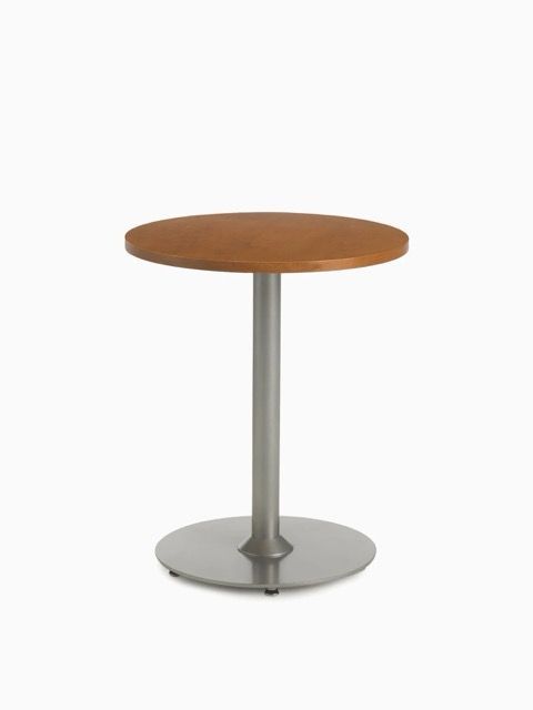 Small round wooden table with a gray metal pedestal base on a white background