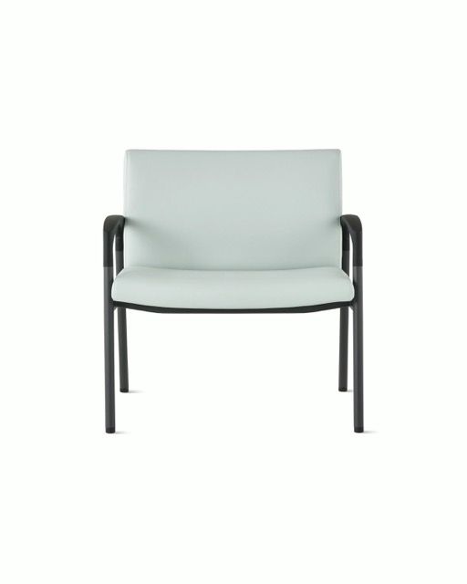 Modern light gray upholstered armchair with black metal arms and legs, centered on a white background