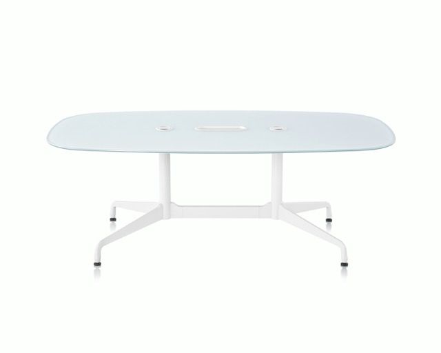 White oval conference table with metal legs and casters on a plain background