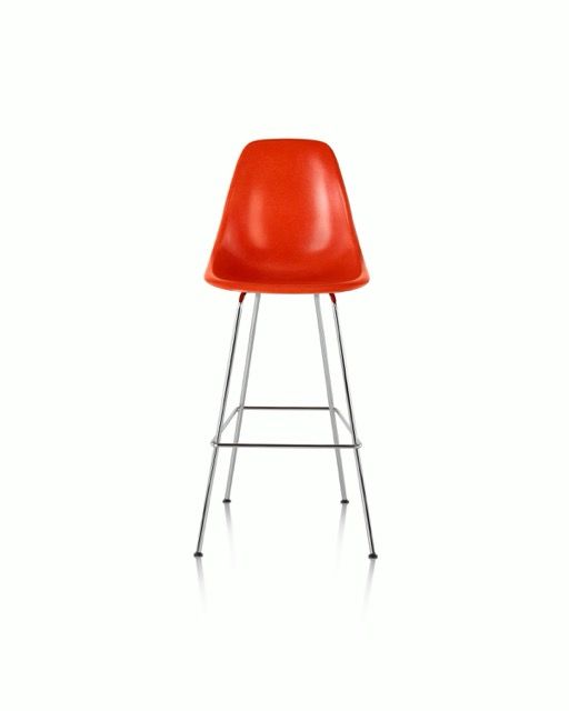 Red bar stool with metal legs on a white background