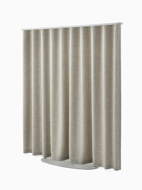 Green pleated curtain partition on a white background