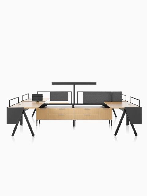 Modern office desk setup with dual monitors, black and wood finishes, and metal railings