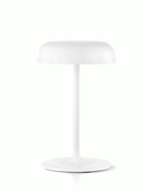 White modern table lamp with a round base and dome-shaped shade