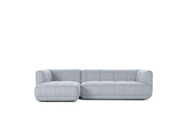 Light gray sectional sofa with chaise on a white background