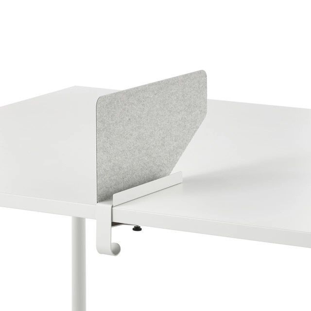 Gray desk privacy divider mounted between two white work surfaces