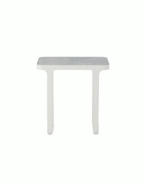 Minimal white table with a gray top on a plain background