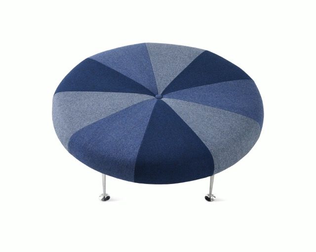 Round blue striped ottoman with metal legs