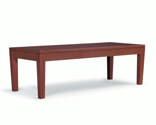 Brown wooden rectangular dining table with four legs on a white background