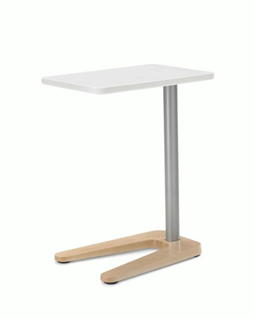 Compact standing desk with white top, metal pole, and light wood base