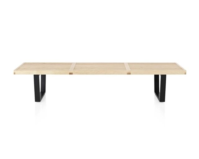 Minimalist wooden bench with black metal legs on a white background